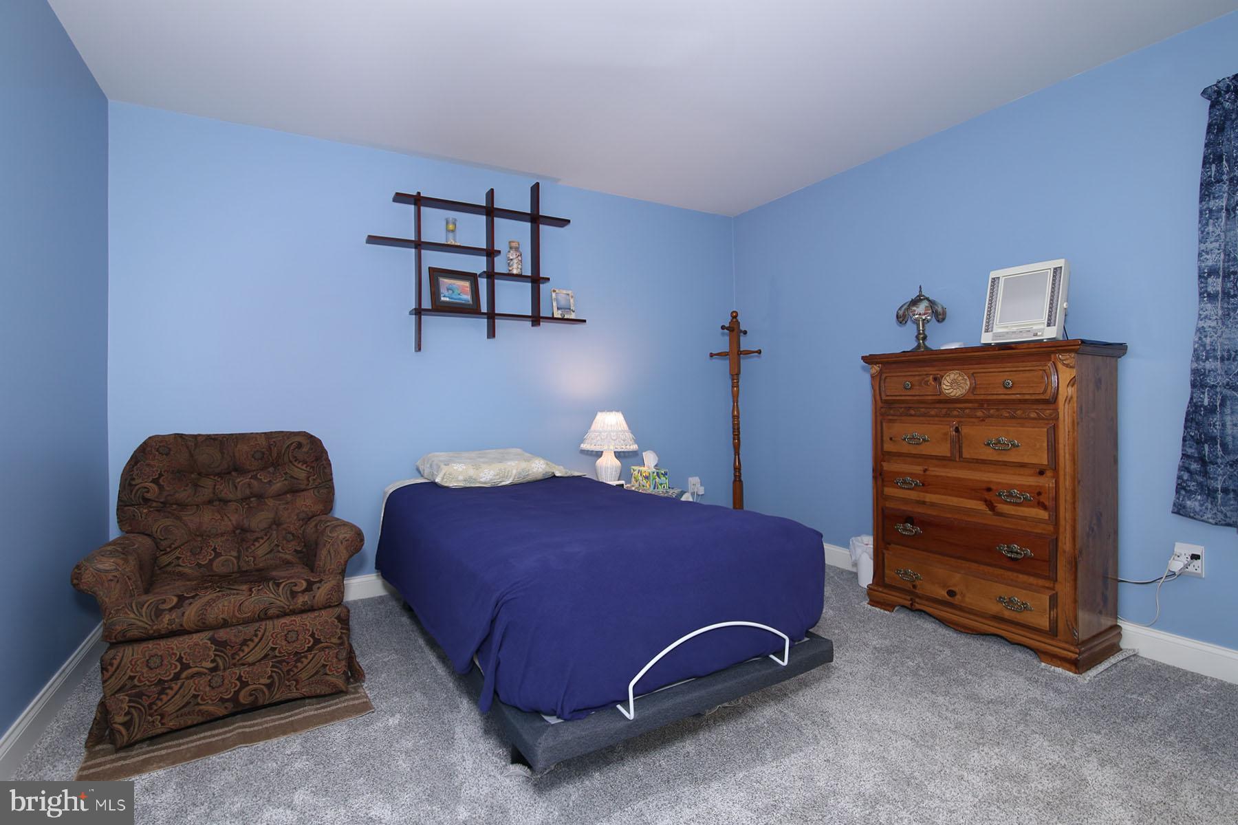 1023 Alden Way Lebanon, PA 17042 - Photo 33 of 74 a bedroom with a bed and a dresser