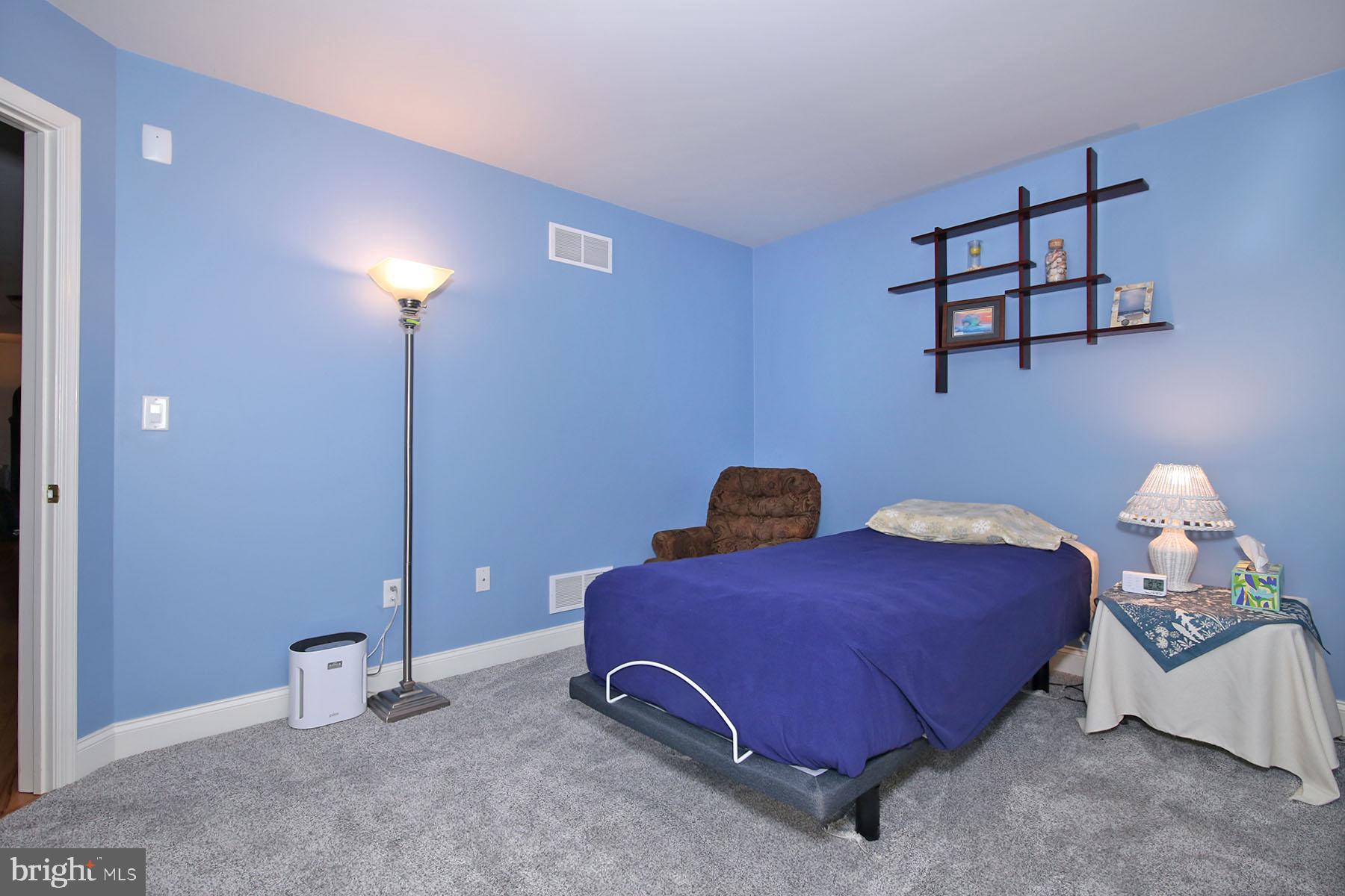 1023 Alden Way Lebanon, PA 17042 - Photo 34 of 74 a bedroom with furniture and a lamp