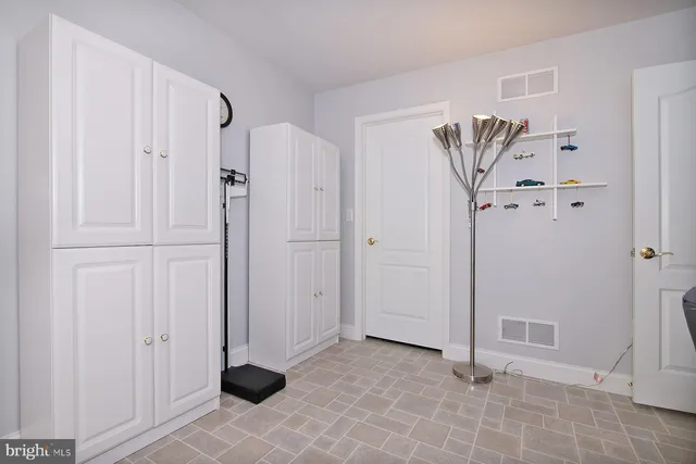 a view of a backyard with plants and outdoor seating