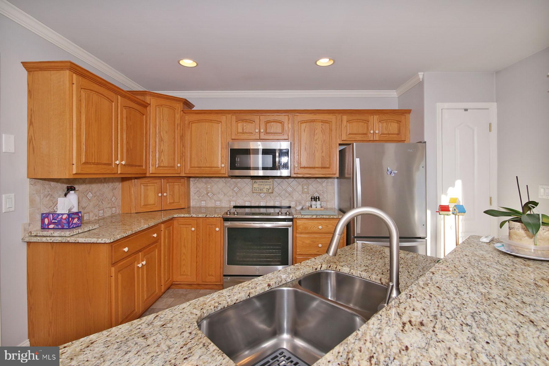 1023 Alden Way Lebanon, PA 17042 - Photo 6 of 74 a kitchen with stainless steel appliances granite countertop a sink stove and refrigerator