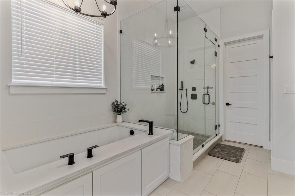 7 Center Court Heath, TX 75032 - Photo 16 of 37 a bathroom with a bathtub and shower