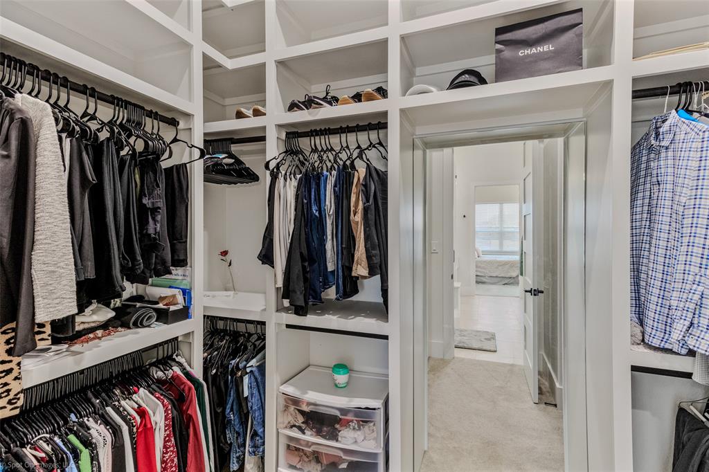 7 Center Court Heath, TX 75032 - Photo 17 of 37 a view of walk in closet with clothes and shoes