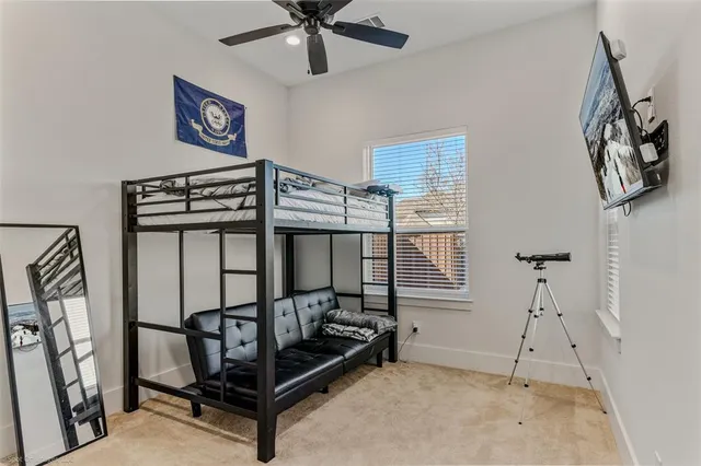 a bedroom with furniture and a window