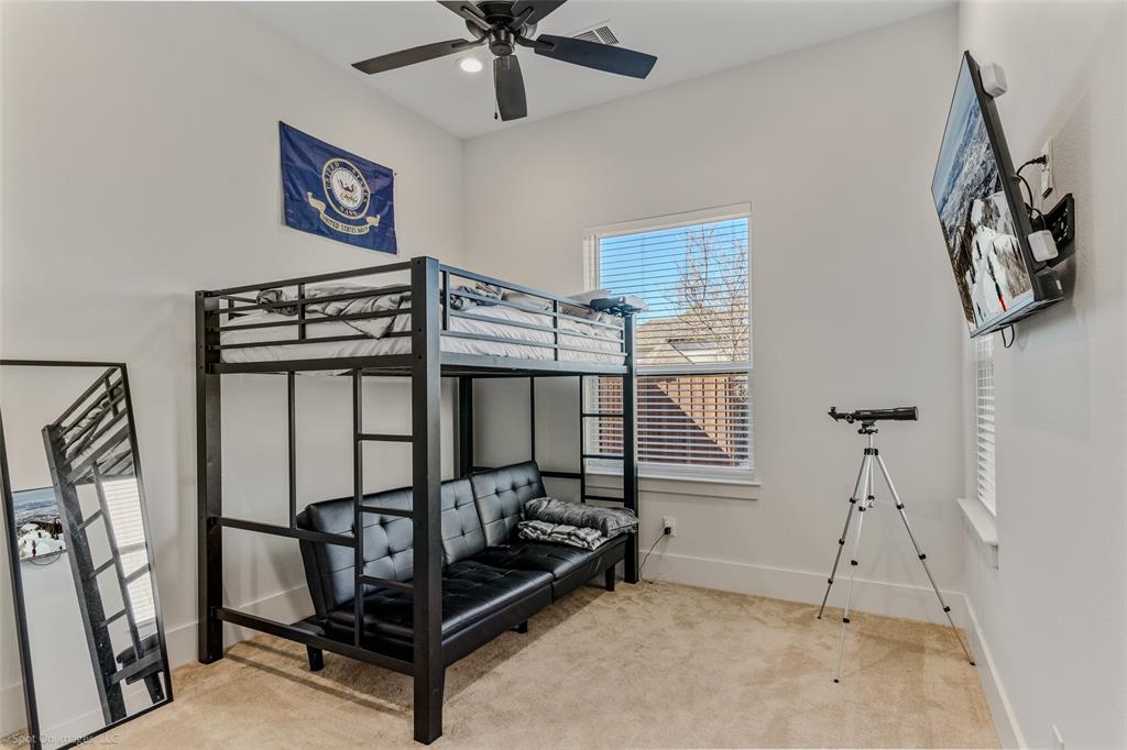 7 Center Court Heath, TX 75032 - Photo 18 of 37 a bedroom with furniture and a window