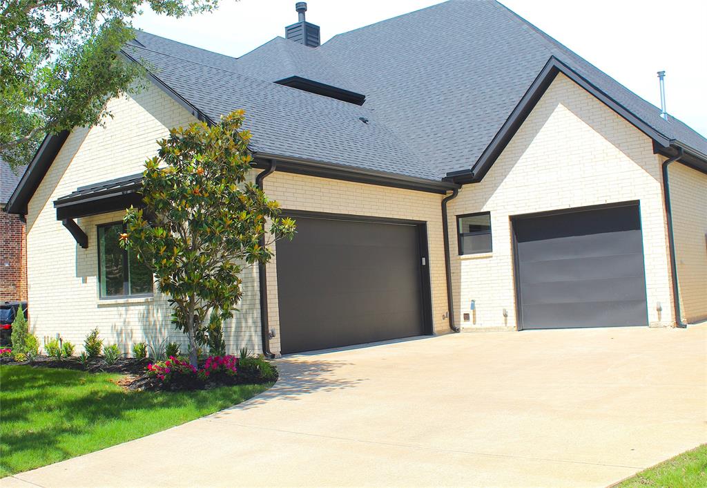 7 Center Court Heath, TX 75032 - Photo 2 of 37 a view of a house with a yard and potted plants