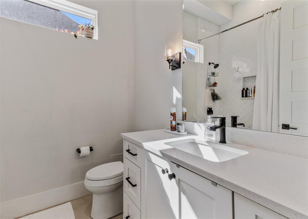 7 Center Court Heath, TX 75032 - Photo 21 of 37 a bathroom with a sink vanity granite and toilet