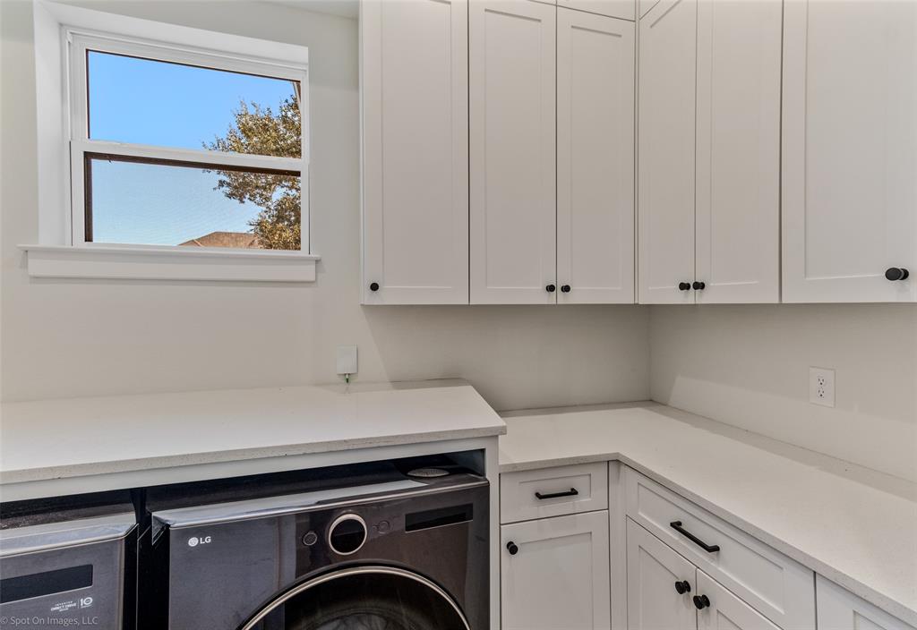 7 Center Court Heath, TX 75032 - Photo 22 of 37 a utility room with dryer and washer