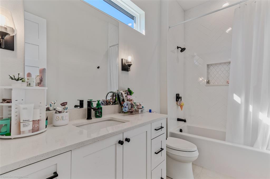 7 Center Court Heath, TX 75032 - Photo 26 of 37 a bathroom with a sink a toilet and shower