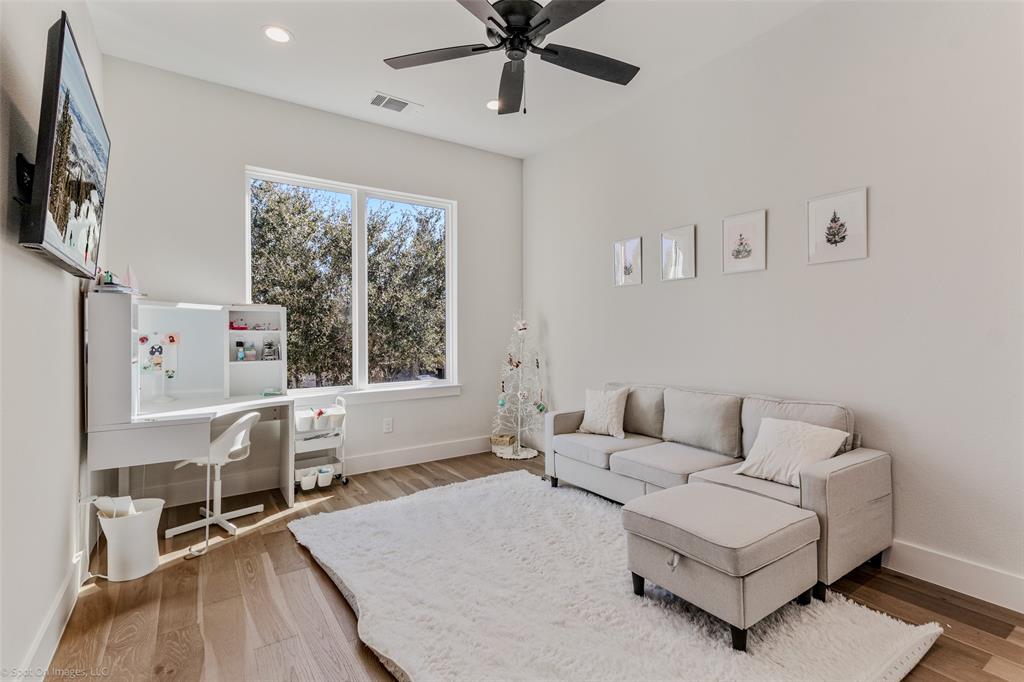 7 Center Court Heath, TX 75032 - Photo 27 of 37 a living room with furniture and a large window