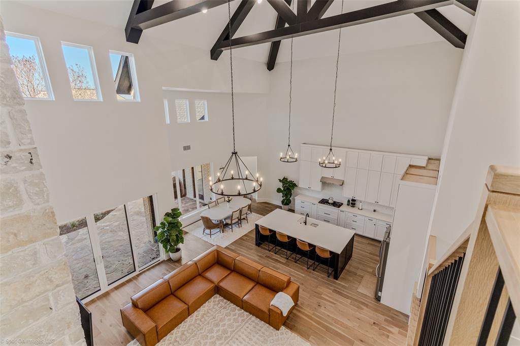 7 Center Court Heath, TX 75032 - Photo 28 of 37 a living room with furniture and a wooden floor
