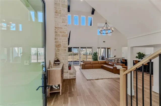 a view of a livingroom with furniture and stairs