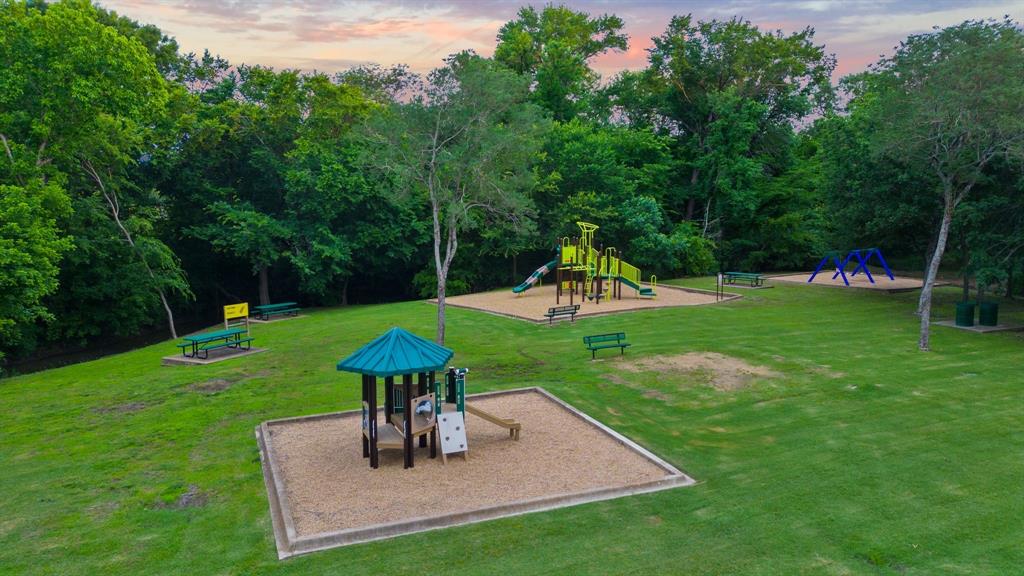7 Center Court Heath, TX 75032 - Photo 33 of 37 a view of a house with a backyard