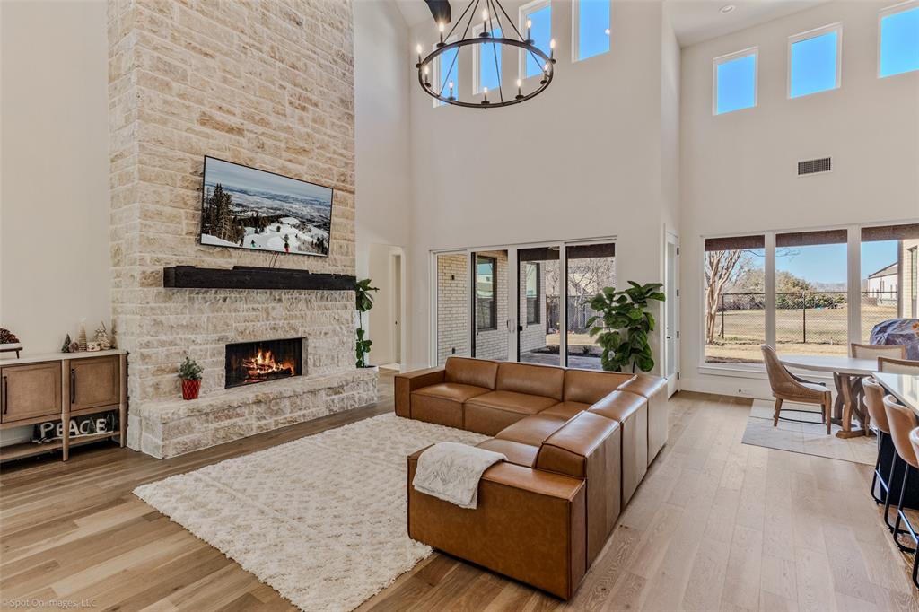 7 Center Court Heath, TX 75032 - Photo 4 of 37 a living room with furniture and a fireplace