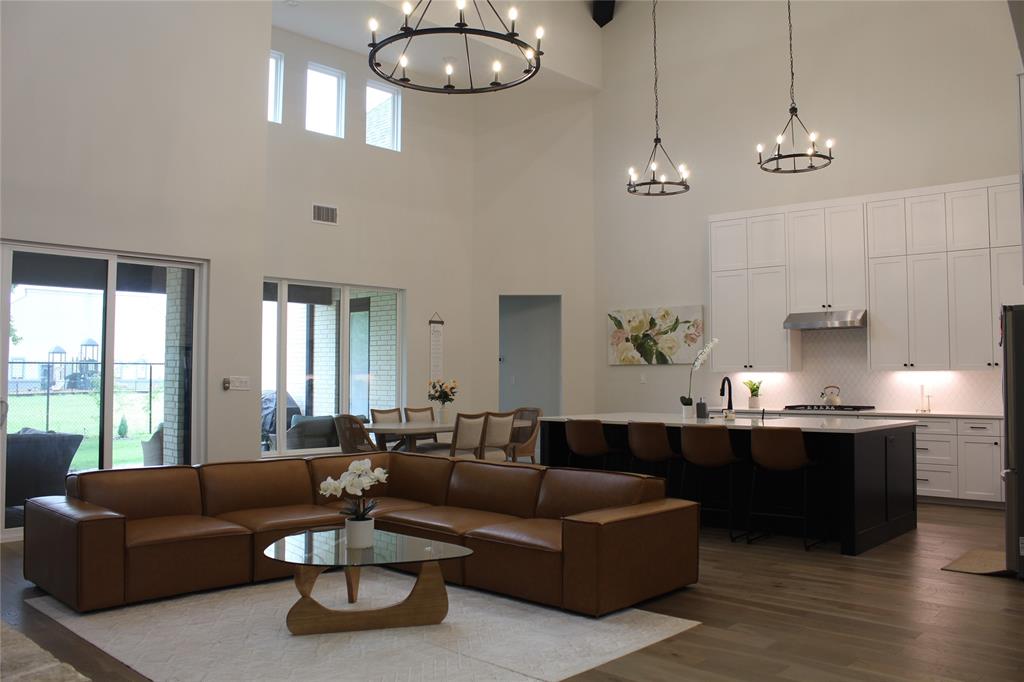 7 Center Court Heath, TX 75032 - Photo 5 of 37 a living room with furniture kitchen and a large window