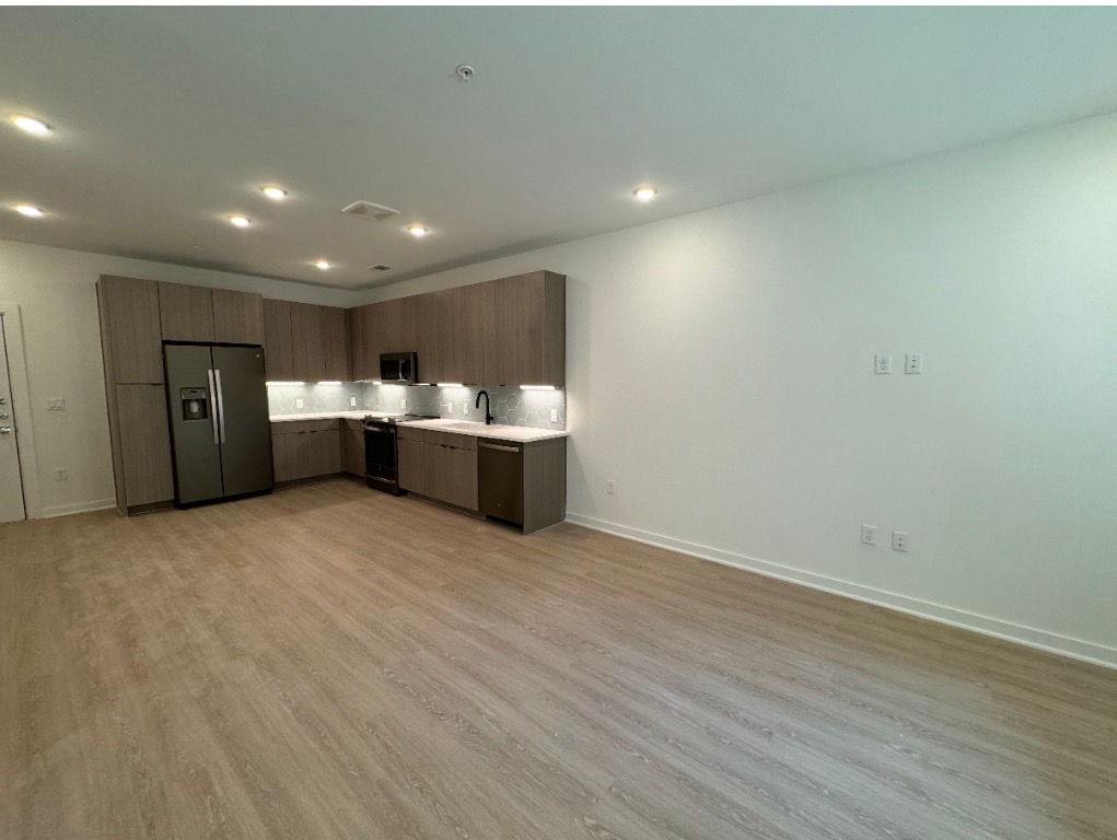 4802 South Congress Avenue, Unit 118 Austin, TX 78745 - Photo 4 of 20 a view of empty room with wooden floor