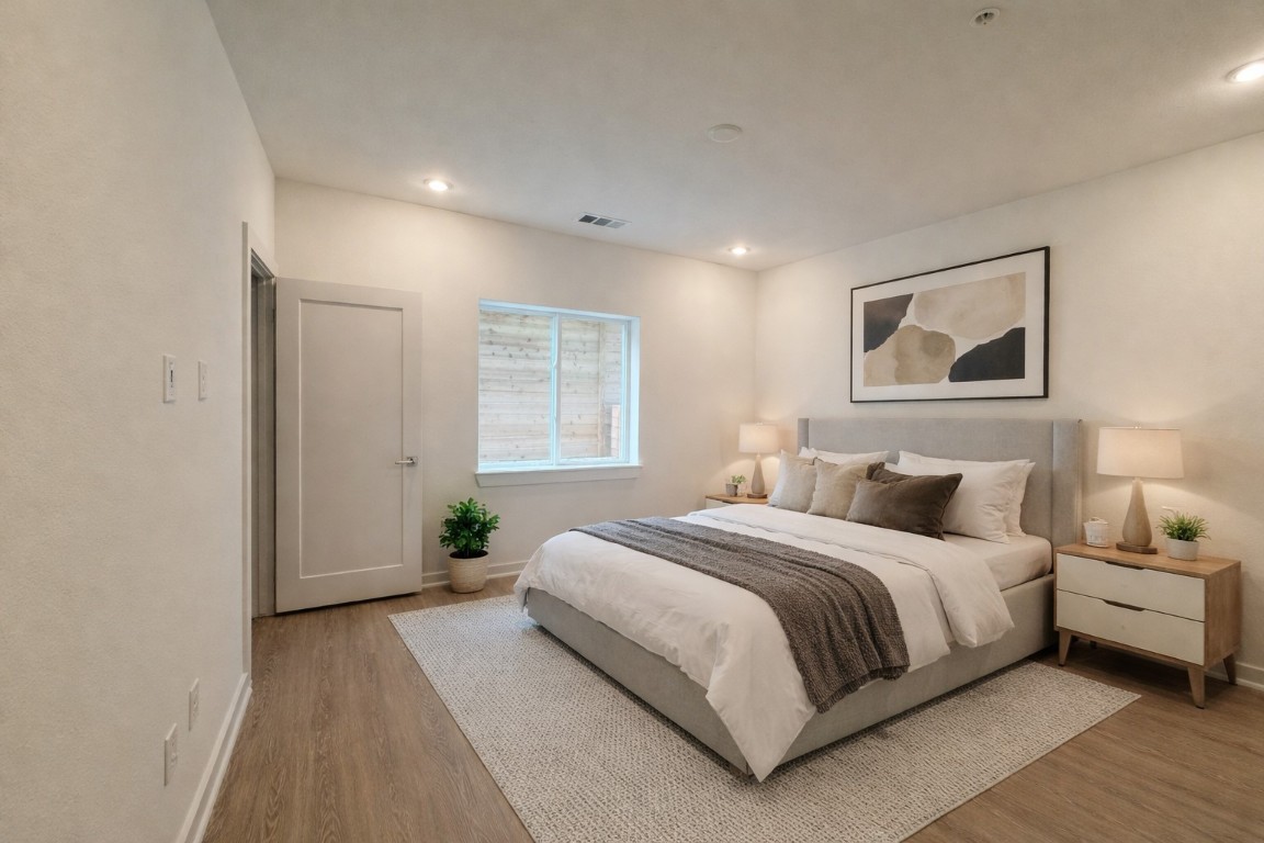 4802 South Congress Avenue, Unit 118 Austin, TX 78745 - Photo 5 of 20 a bedroom with a large bed and a window