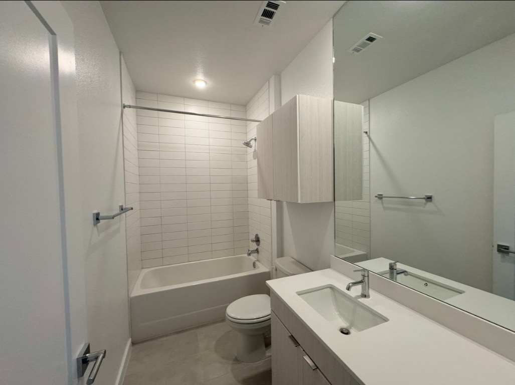 4802 South Congress Avenue, Unit 118 Austin, TX 78745 - Photo 9 of 20 a bathroom with a sink toilet and shower