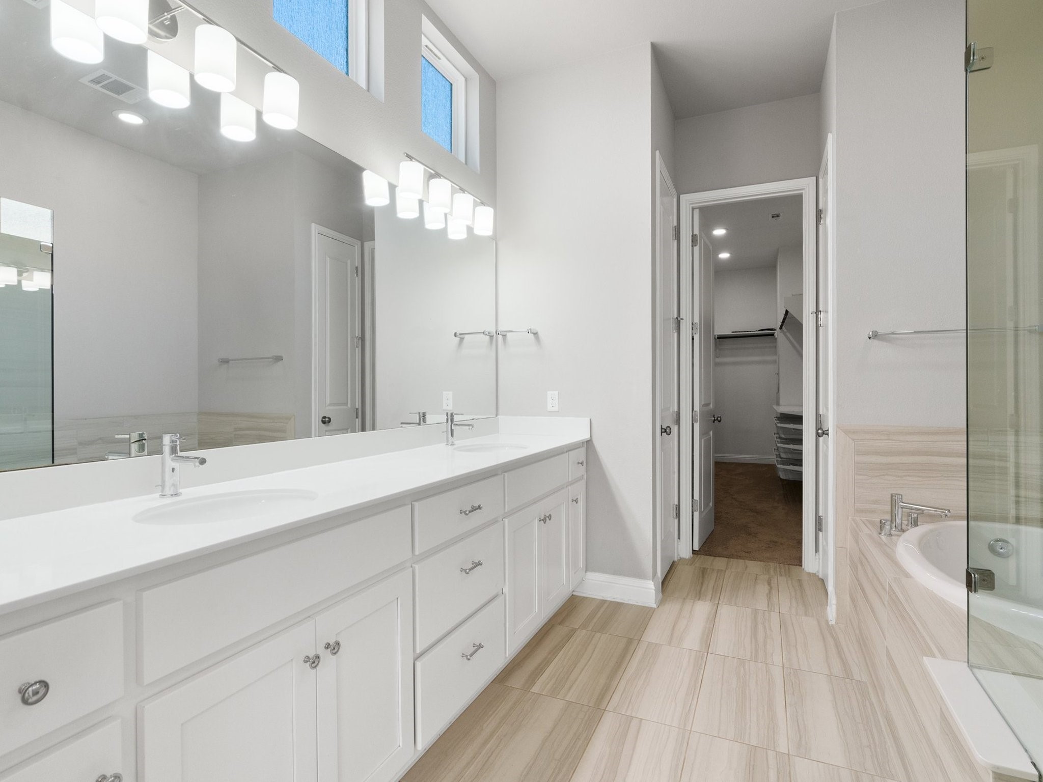 5305 Mandevilla Drive Austin, TX 78739 - Photo 17 of 27 Your personal spa awaits in the ensuite bath, adorned with modern finishes