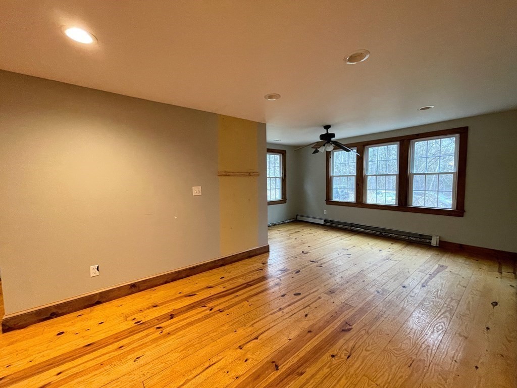 163 East Rindge Road Ashburnham, MA 01430 - Photo 16 of 42 wooden floor in an empty room with a window