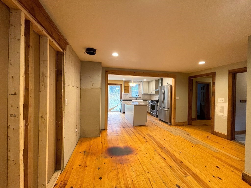 163 East Rindge Road Ashburnham, MA 01430 - Photo 17 of 42 a view of a kitchen with wooden floor and a sink