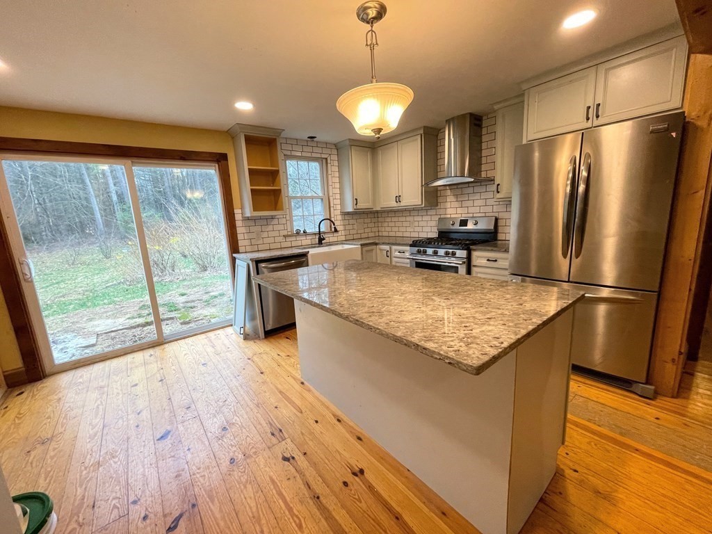 163 East Rindge Road Ashburnham, MA 01430 - Photo 20 of 42 a kitchen with stainless steel appliances granite countertop a refrigerator a stove top oven a sink and dishwasher