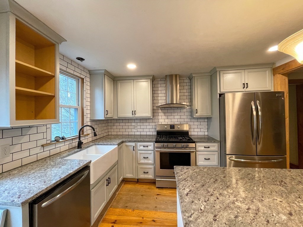 163 East Rindge Road Ashburnham, MA 01430 - Photo 21 of 42 a kitchen with stainless steel appliances granite countertop a sink stove refrigerator and cabinets