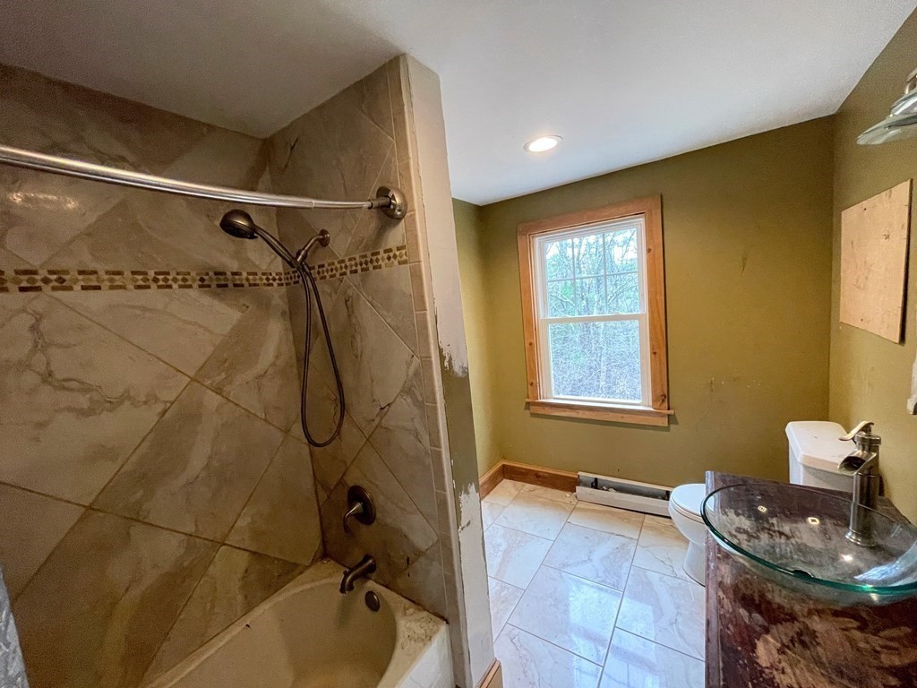 163 East Rindge Road Ashburnham, MA 01430 - Photo 23 of 42 a bathroom with a tub a window and a shower