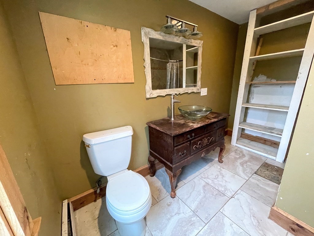 163 East Rindge Road Ashburnham, MA 01430 - Photo 25 of 42 a bathroom with a toilet a sink and a mirror