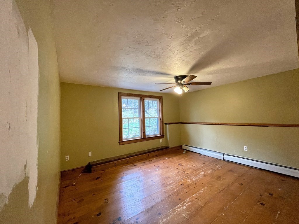 163 East Rindge Road Ashburnham, MA 01430 - Photo 26 of 42 an empty room with chandelier fan and windows