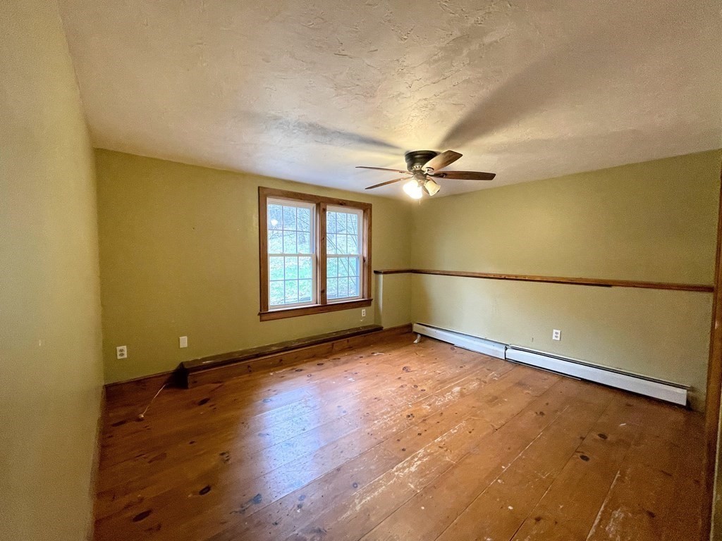 163 East Rindge Road Ashburnham, MA 01430 - Photo 27 of 42 an empty room with wooden floor and windows