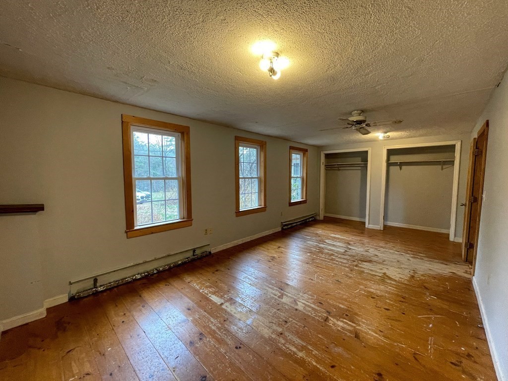 163 East Rindge Road Ashburnham, MA 01430 - Photo 29 of 42 an empty room with wooden floor and windows