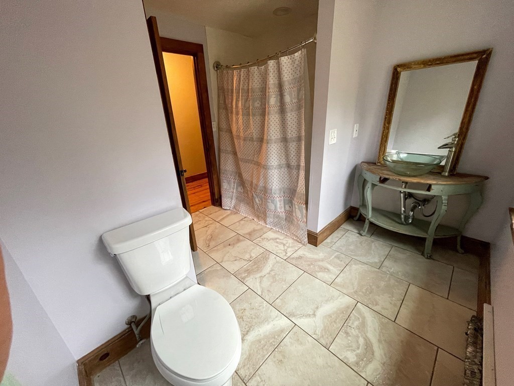 163 East Rindge Road Ashburnham, MA 01430 - Photo 33 of 42 a bathroom with a toilet mirror and vanity