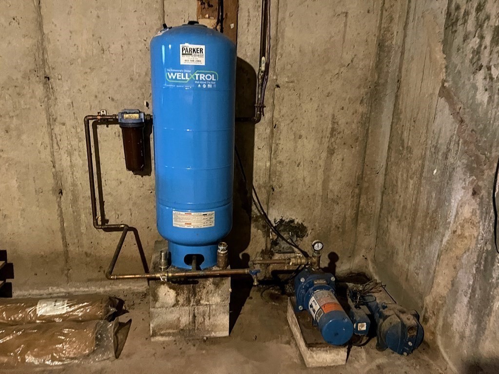163 East Rindge Road Ashburnham, MA 01430 - Photo 38 of 42 a room with water heater and wooden door