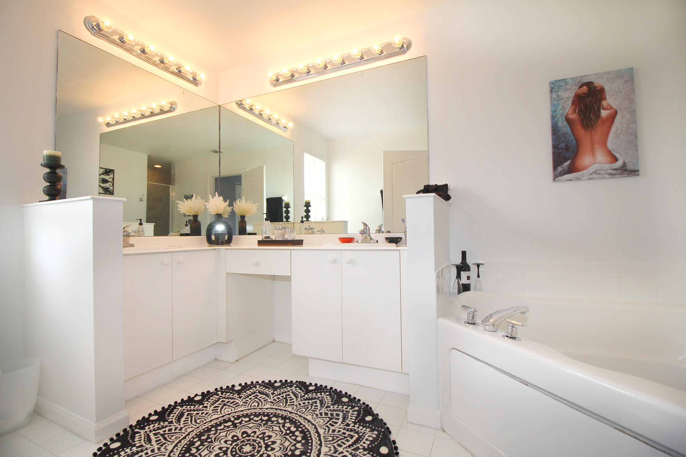 5809 Raceway Road Lake Worth, FL 33449 - Photo 12 of 13 a bathroom with a sink a mirror and a shower