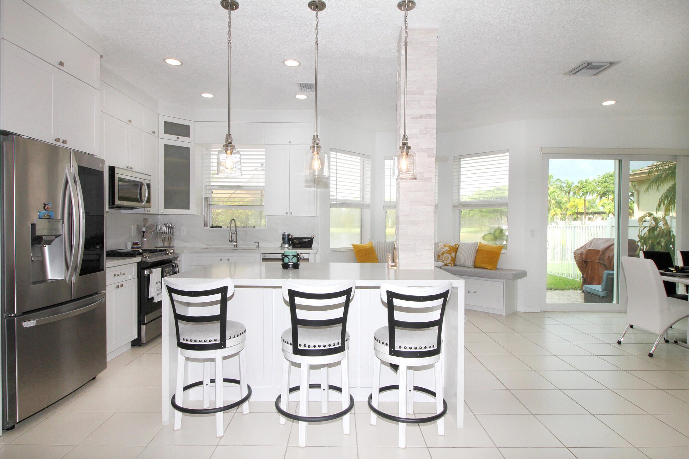 5809 Raceway Road Lake Worth, FL 33449 - Photo 5 of 13 a kitchen with lots of counter space and appliances
