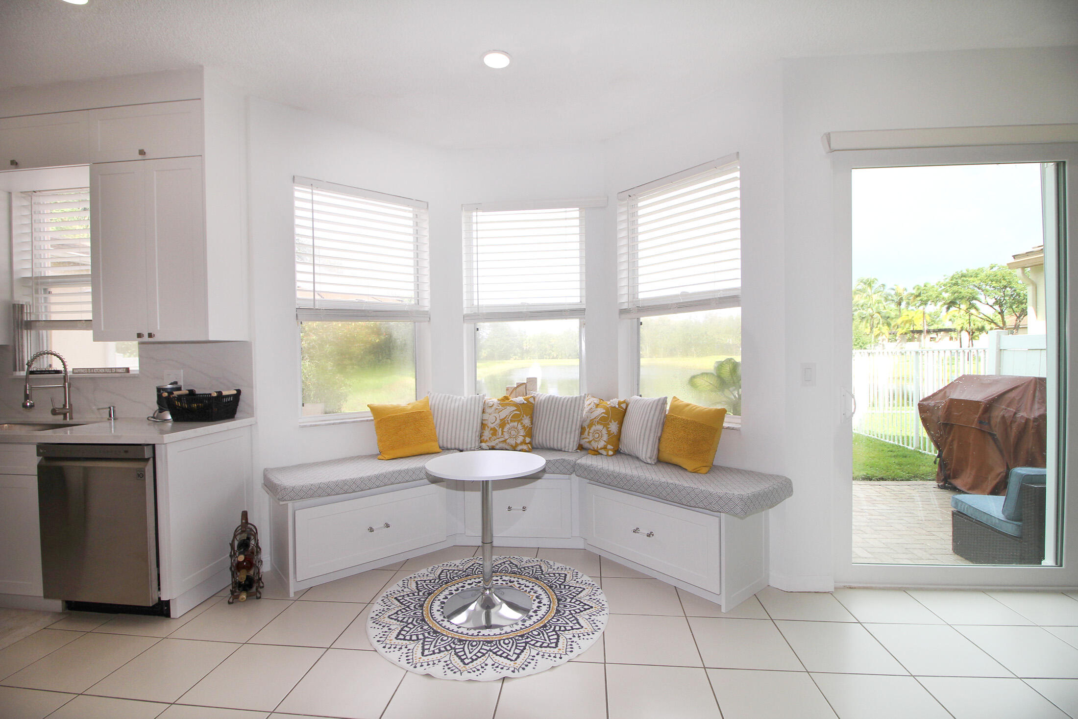 5809 Raceway Road Lake Worth, FL 33449 - Photo 7 of 13 a living room with furniture a rug floor and a large window