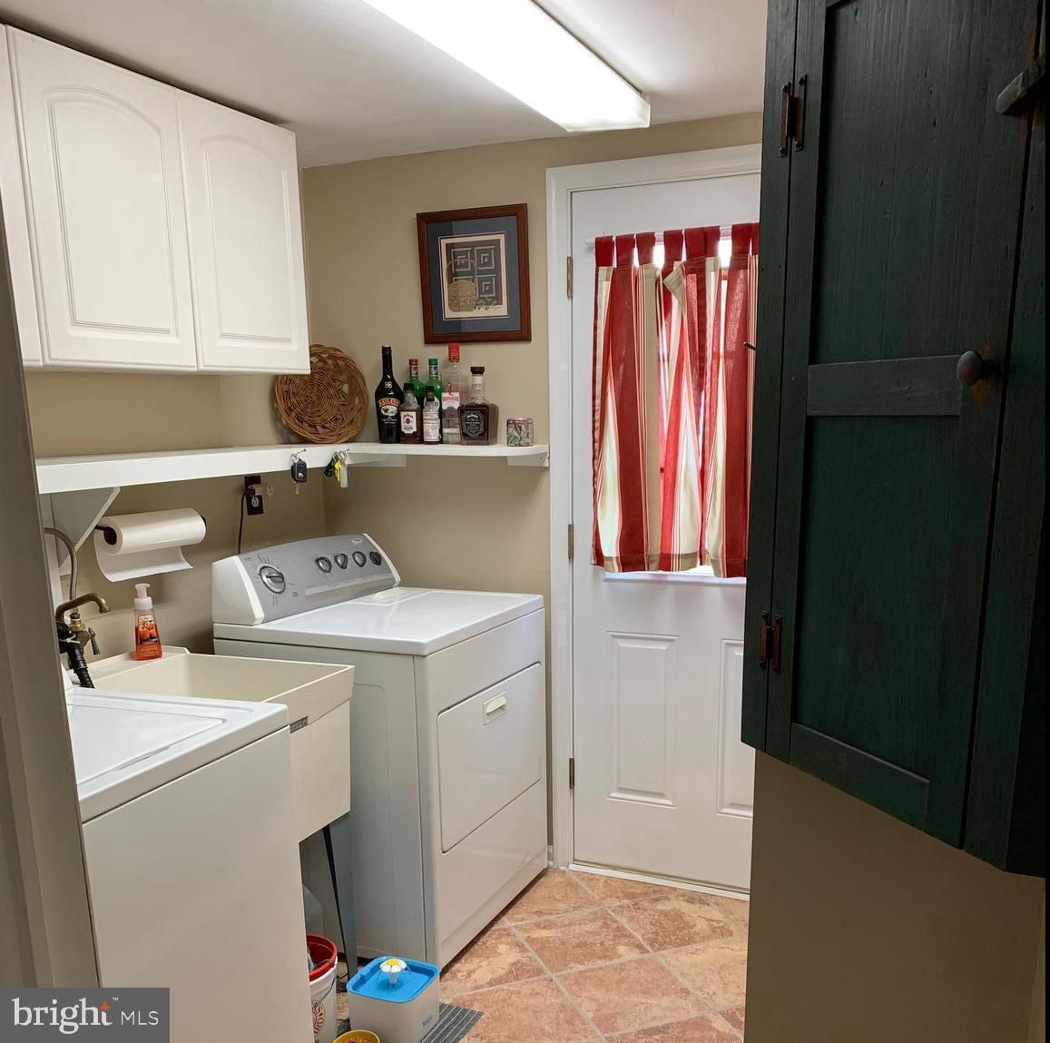 1348 Swamp Road Furlong, PA 18925 - Photo 20 of 36 First Floor Laundry Room with door to the outside