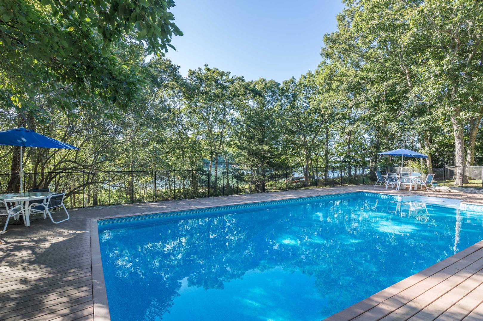 72 Fenmarsh Road East Hampton, NY 11937 - Photo 19 of 20 a view of a swimming pool with a patio