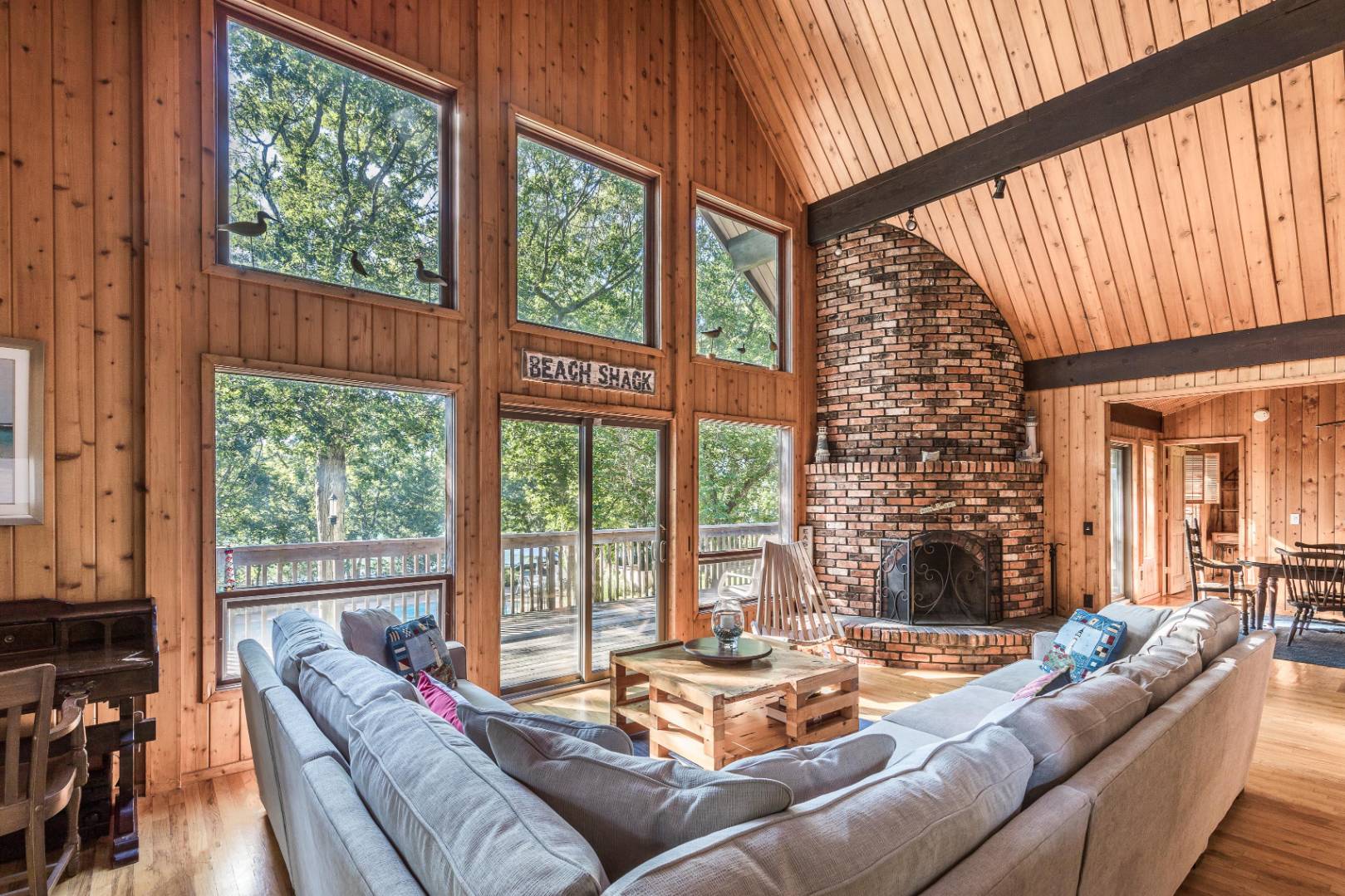 72 Fenmarsh Road East Hampton, NY 11937 - Photo 3 of 20 a living room with furniture and a fireplace