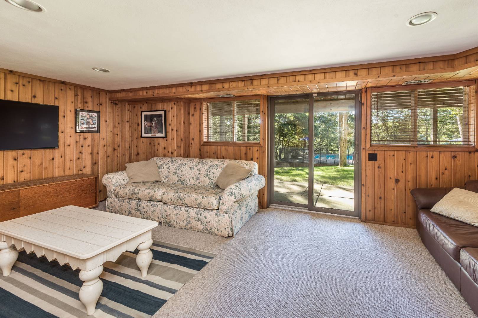 72 Fenmarsh Road East Hampton, NY 11937 - Photo 10 of 20 a bedroom with furniture and a flat screen tv