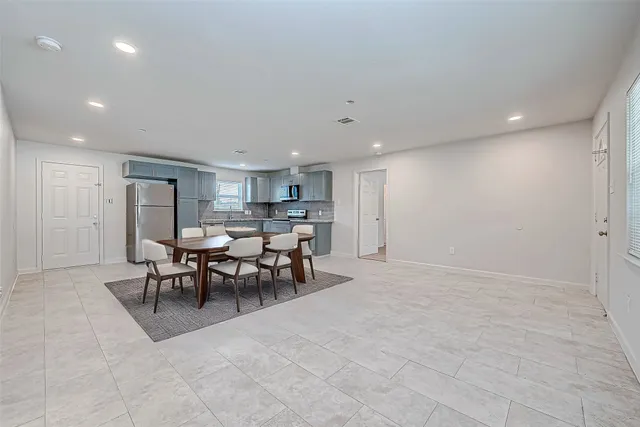 a view of a kitchen and dining room