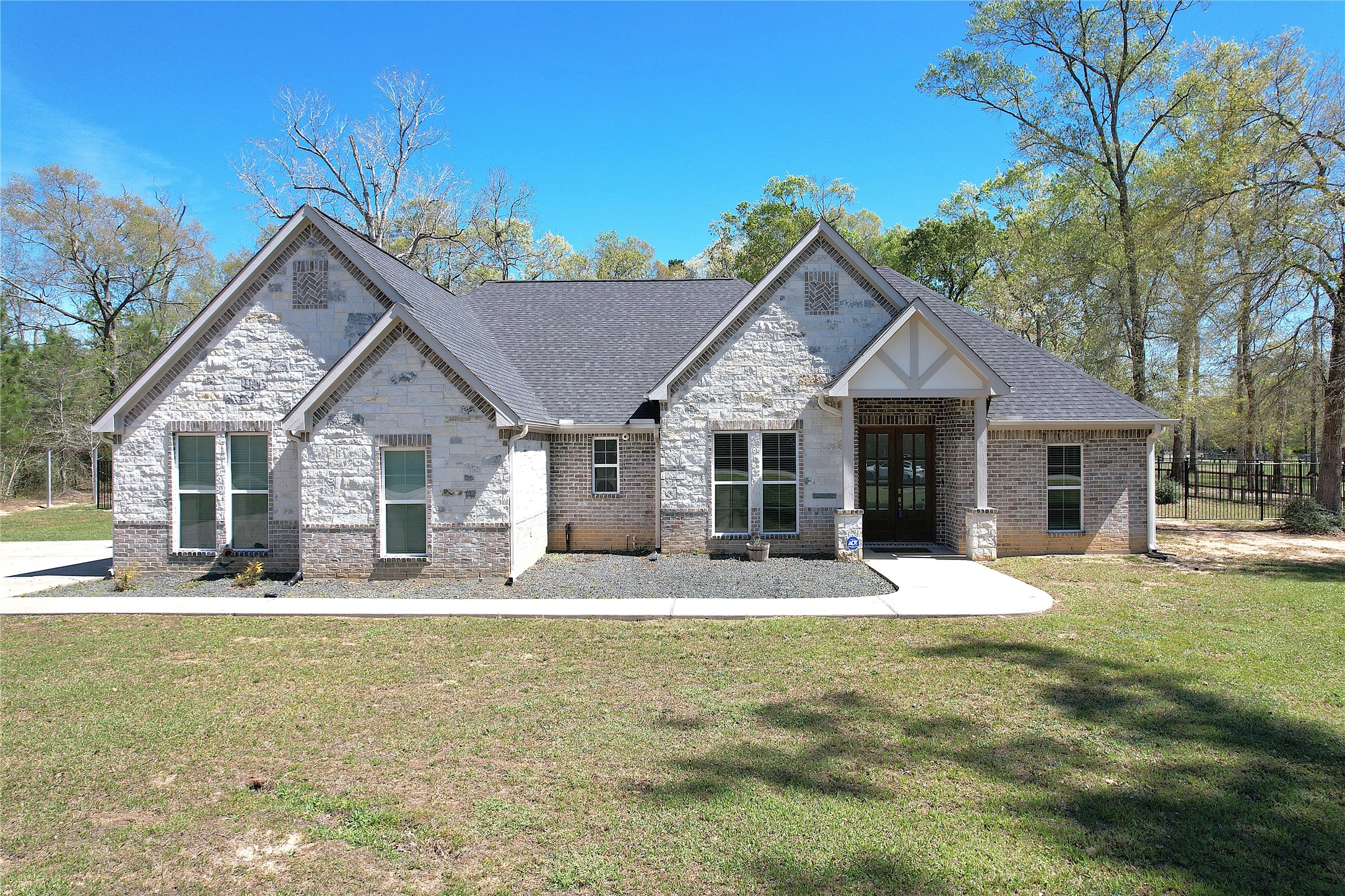 7815 Timber Switch Road Cleveland, TX 77328 - Photo 1 of 40 a front view of house with yard outdoor seating and yard in back