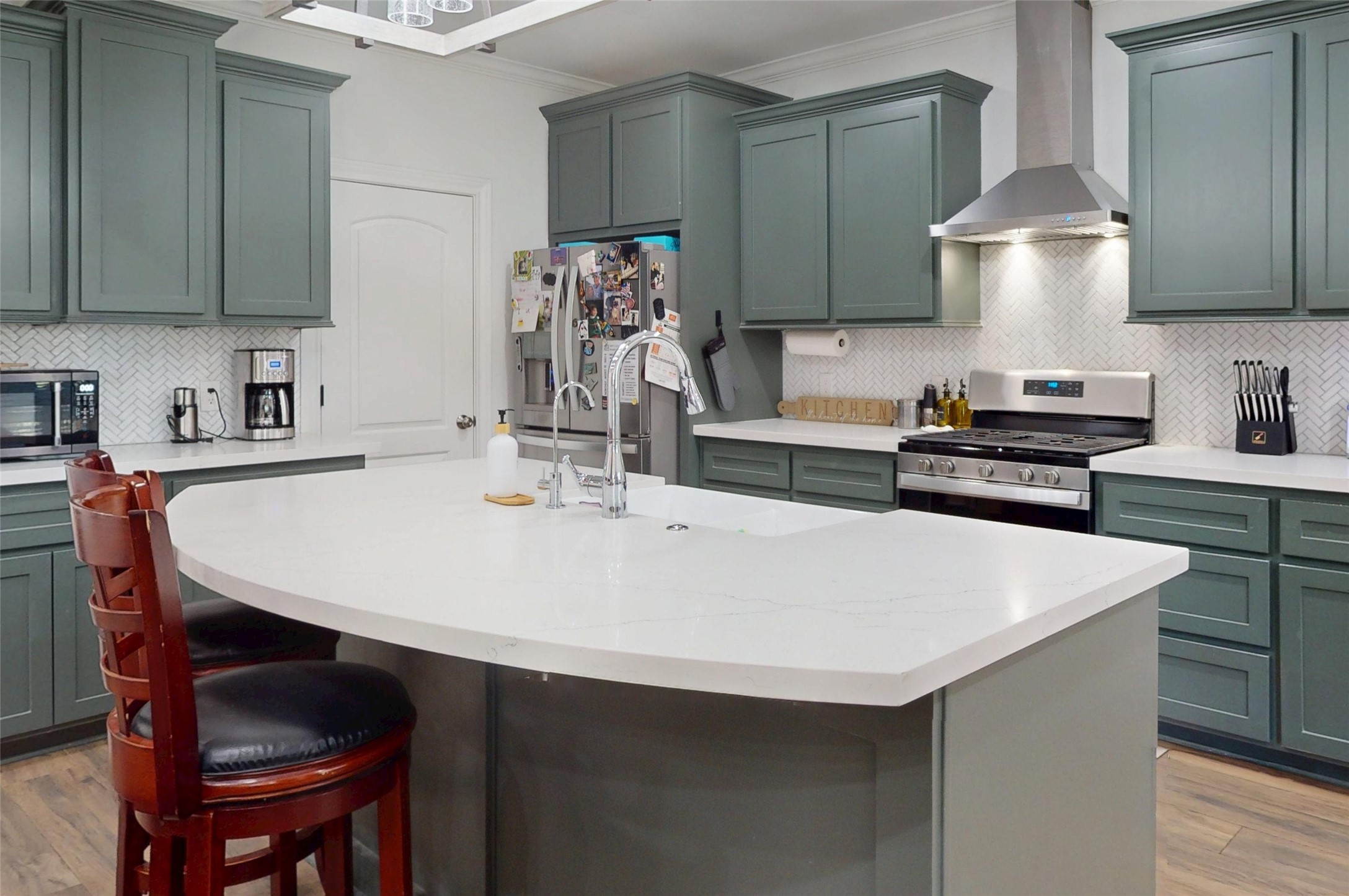 7815 Timber Switch Road Cleveland, TX 77328 - Photo 13 of 40 a kitchen with a table chairs stove and cabinets