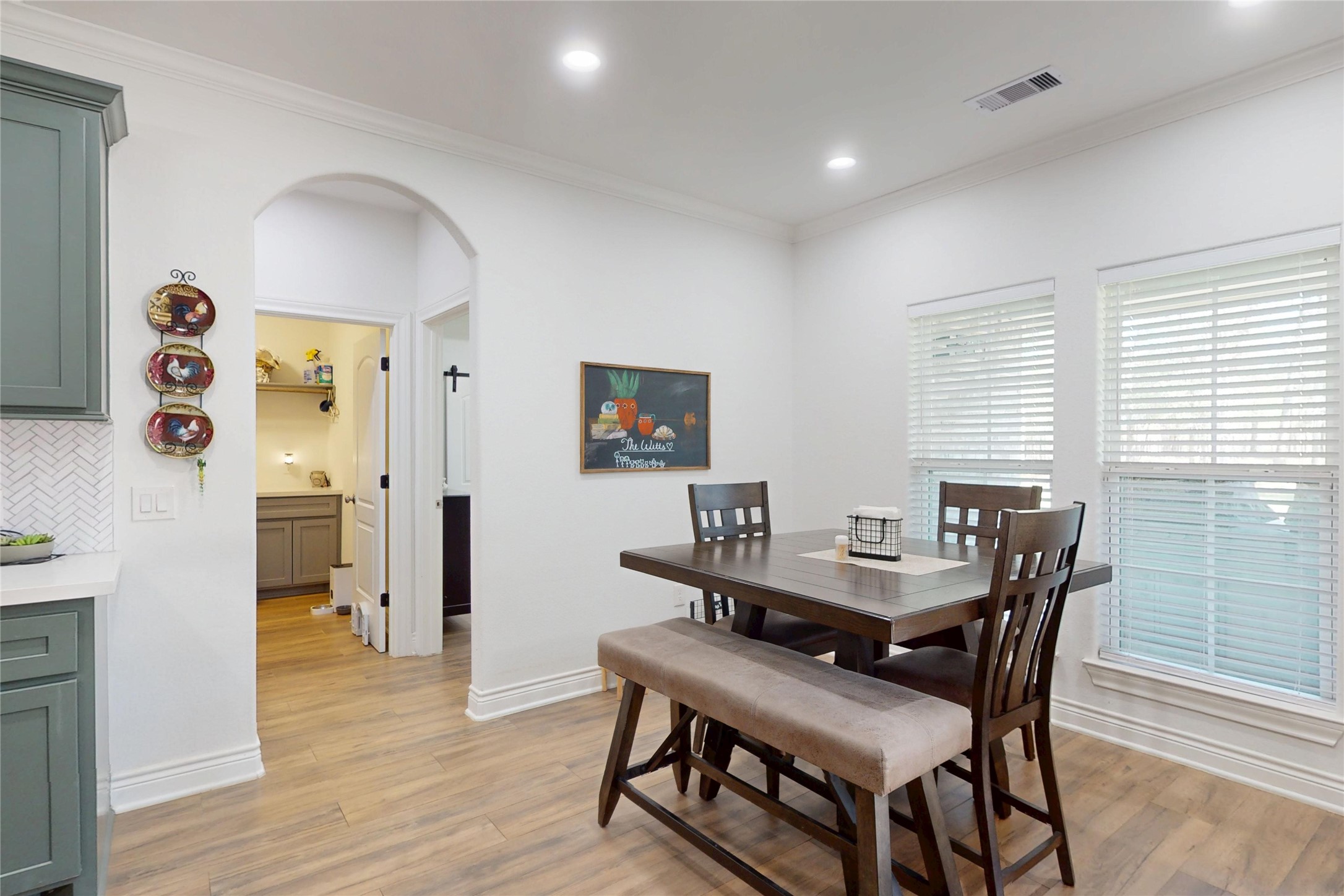 7815 Timber Switch Road Cleveland, TX 77328 - Photo 17 of 40 a dining room with furniture and wooden floor