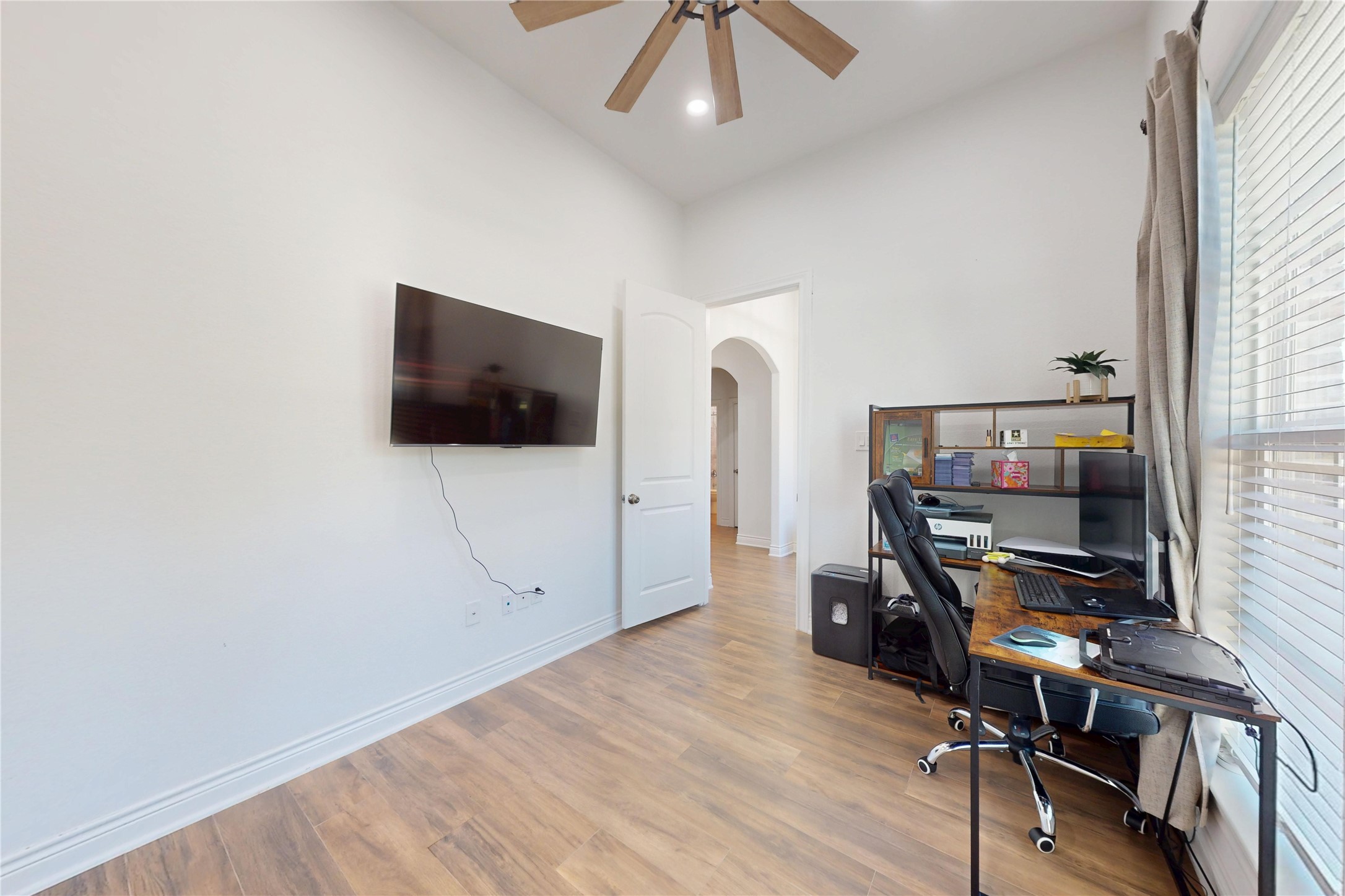 7815 Timber Switch Road Cleveland, TX 77328 - Photo 20 of 40 a view of a workspace with furniture and wooden floor