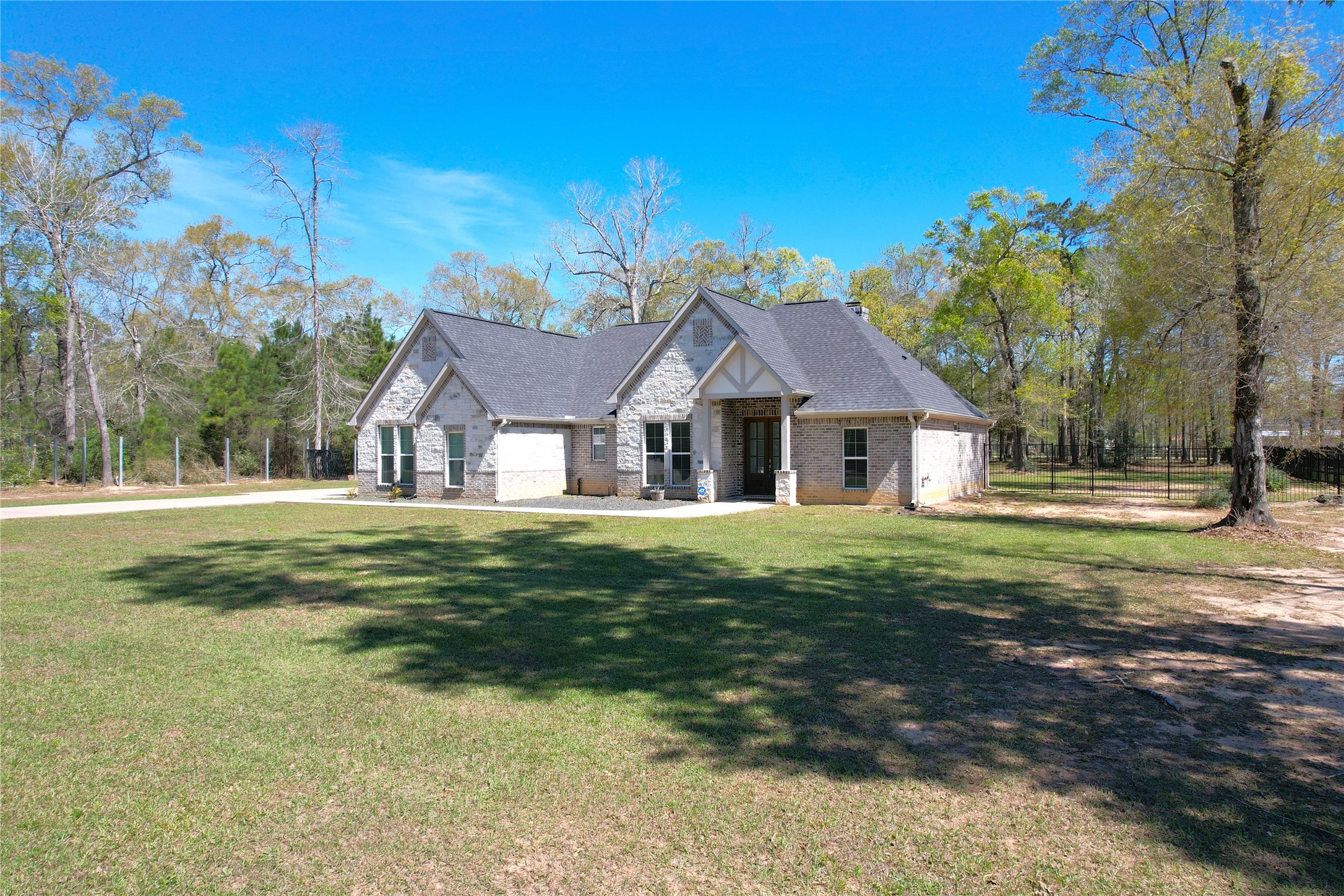 7815 Timber Switch Road Cleveland, TX 77328 - Photo 2 of 40 a view of house with garden