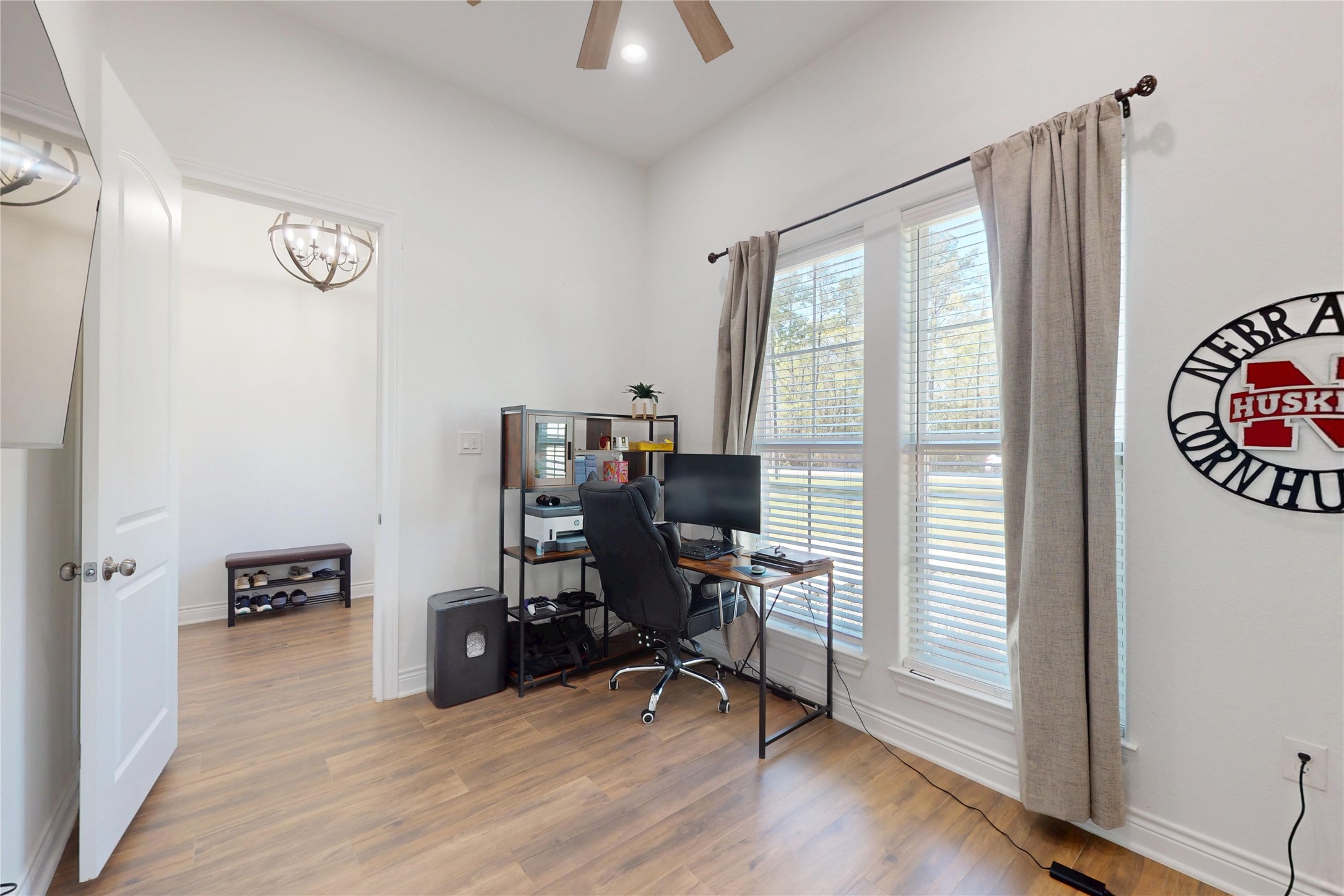 7815 Timber Switch Road Cleveland, TX 77328 - Photo 21 of 40 a view of a workspace with furniture and a window
