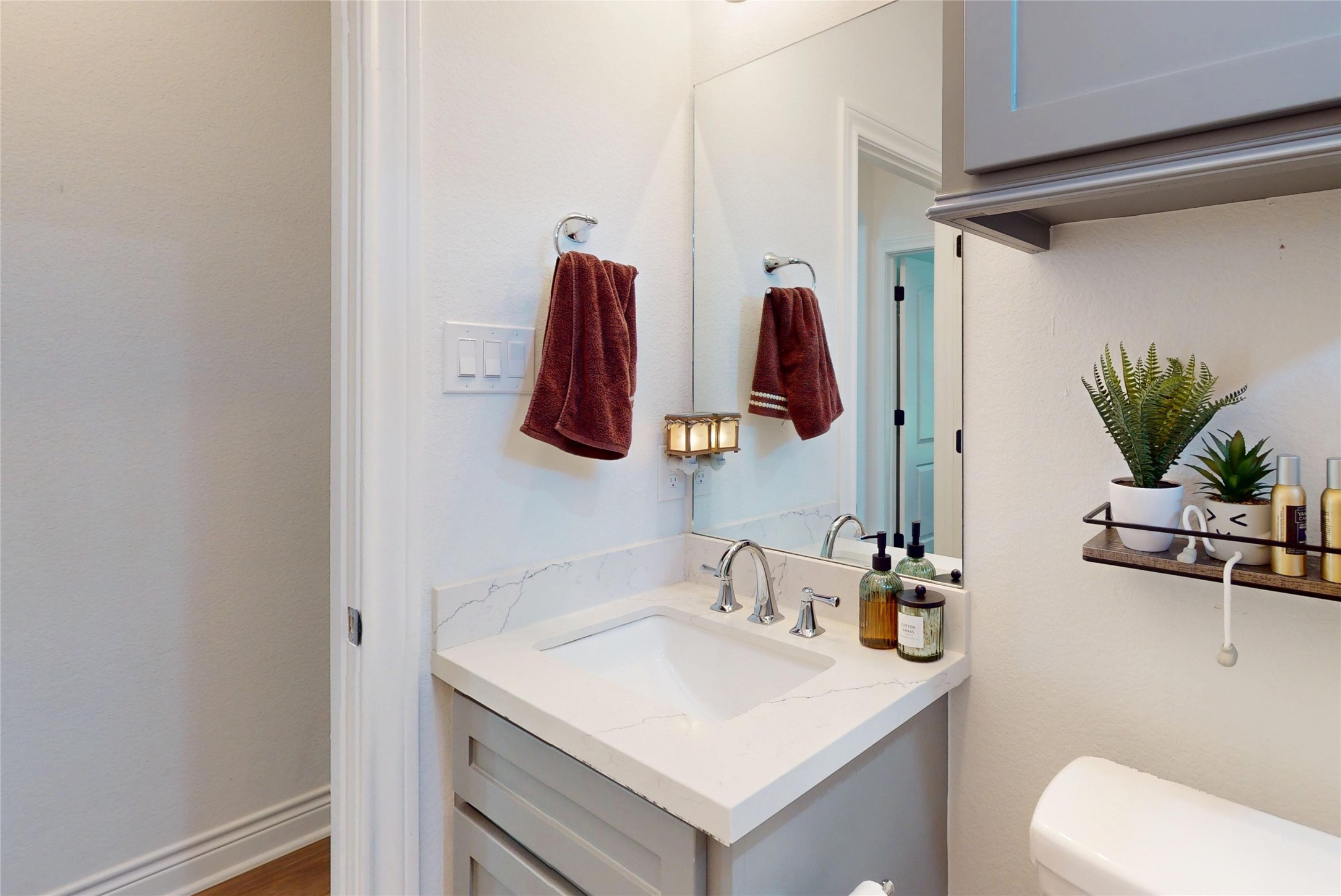 7815 Timber Switch Road Cleveland, TX 77328 - Photo 24 of 40 a bathroom with a sink a mirror and vanity