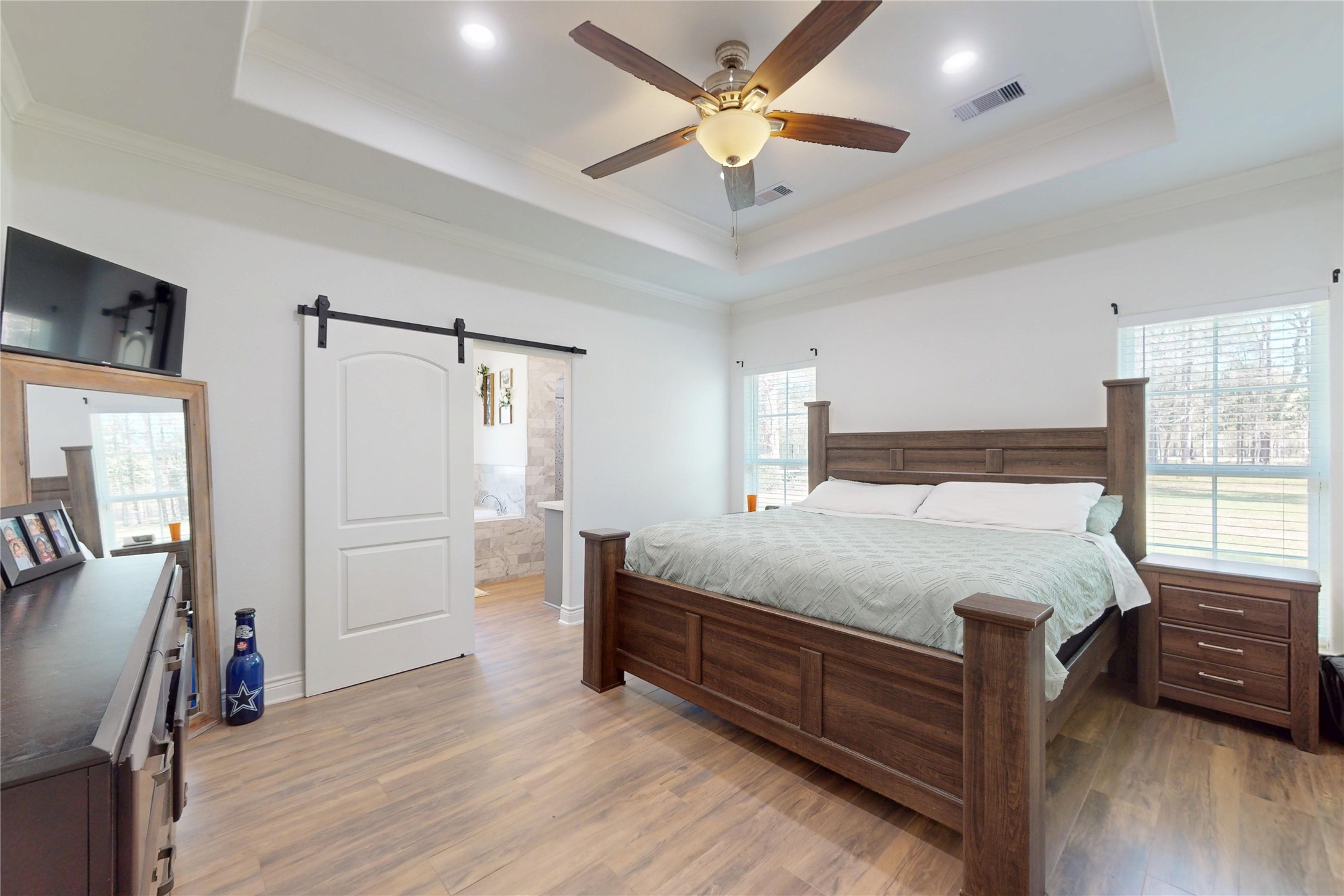 7815 Timber Switch Road Cleveland, TX 77328 - Photo 28 of 40 a bed room with a bed and a ceiling fan