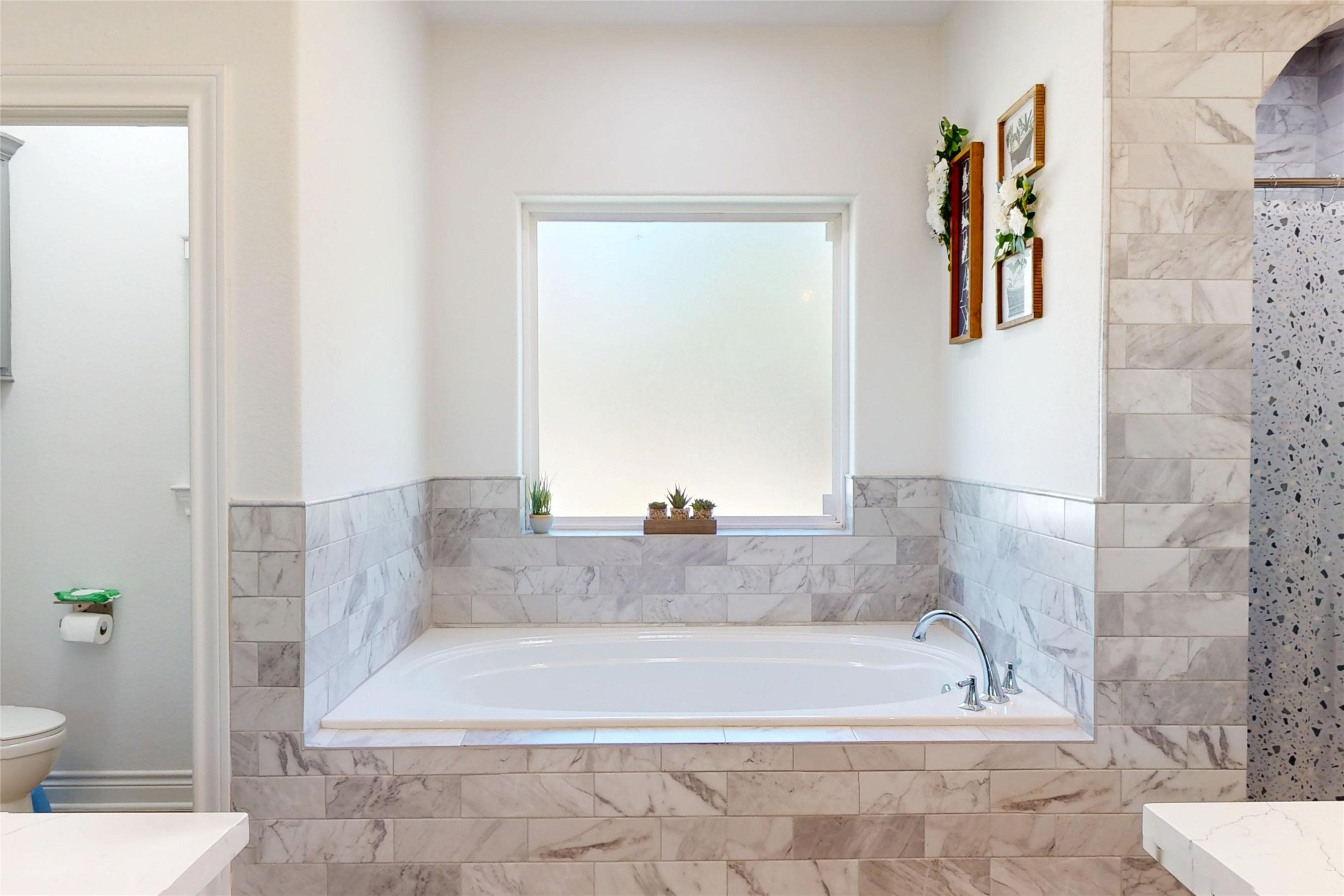 7815 Timber Switch Road Cleveland, TX 77328 - Photo 30 of 40 a bath tub sitting next to a white toilet